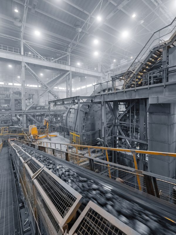 industrial ball mill grinds ore at mining and concentrating plant. concentration factory for copper, gold, magnetite concentrate.